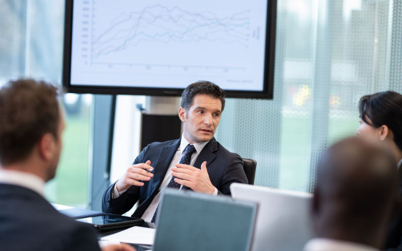 Executive man speaking at a board meeting